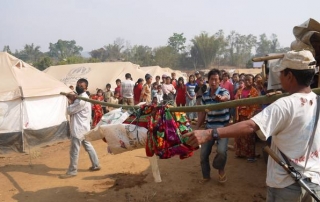 Carrying the body of the fire victim